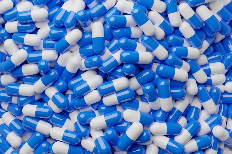 White,And,Blue,Pills,Capsules,On,Top,Full,Picture